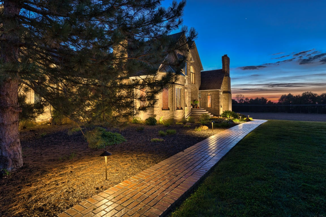 Landscape lighting along a home exterior